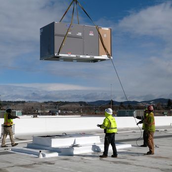 Residential HVAC installation including furnace and heat pump in Spokane new construction home